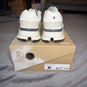 On Running White and Gray Athletic Shoes with CloudTec Sole